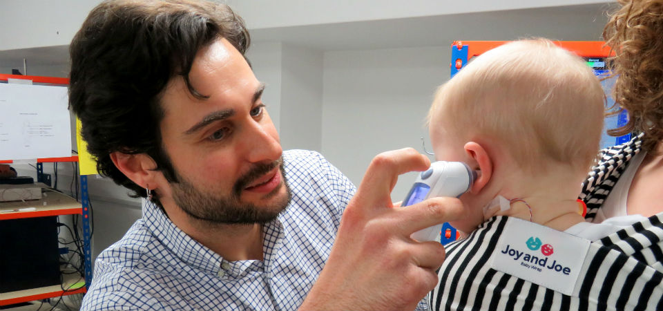 baby with a device in his ear